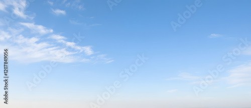 Fototapeta Naklejka Na Ścianę i Meble -  Blue sky with flowing cloud shapes, soft and bright lighting, realistic,