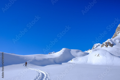 Sci alpinista sale verso il Lago delle Pigne in inverno. Alpi Svizzere, Valle Bedretto photo