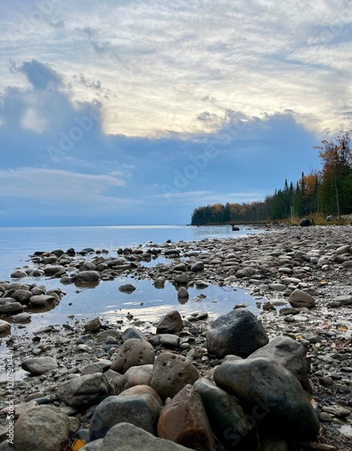 Peaceful sunrise on stone covered beach on Manitoulin Island photo