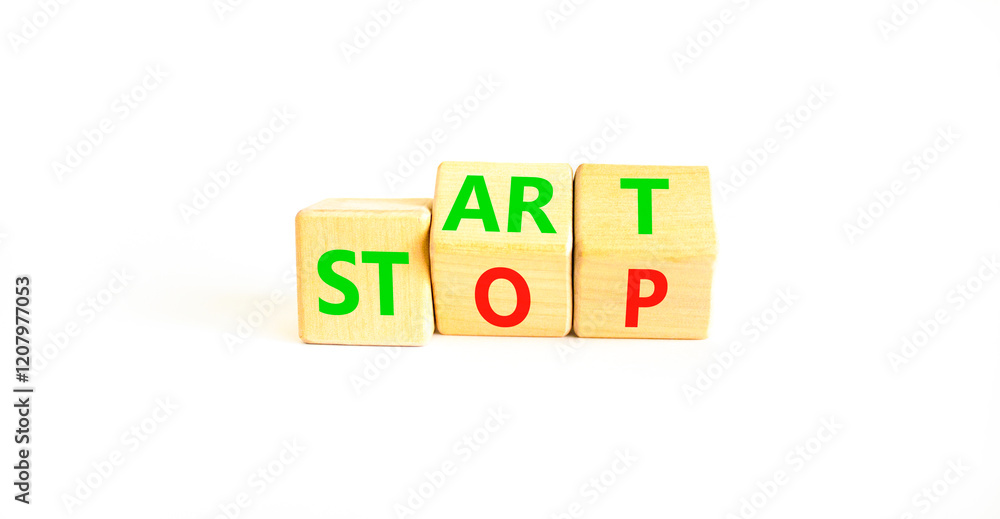 Start or stop symbol. Concept words Start or Stop on beautiful wooden block. Beautiful white table white background. Business start or stop concept. Copy space.