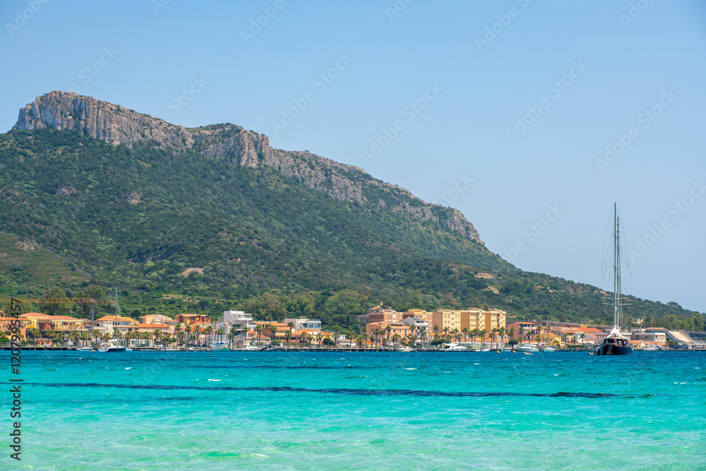 Golfo Aranci beach view from the other side of the bay with turquoise water in Sardinia, Italy Golfo Aranci beach view from the other side of the bay with turquoise water in Sardinia, Italy