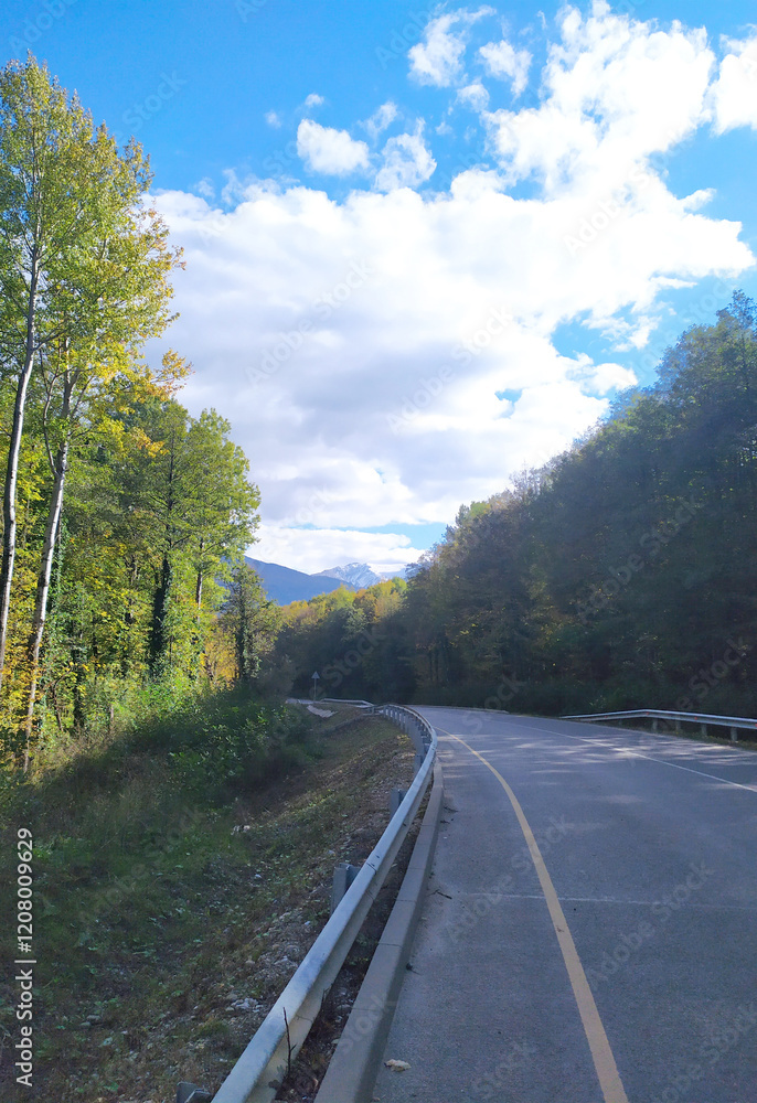 paved highway in a mountainous area in early autumn with panoramic views paved highway in a mountainous area in early autumn with panoramic views
