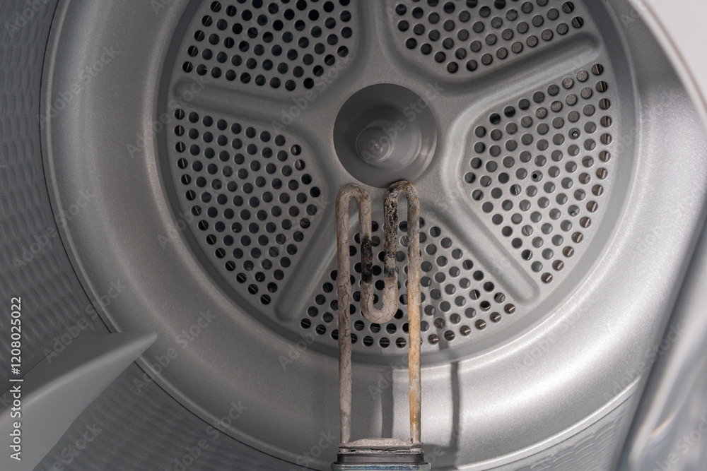 Inside the Washing Machine Drum: Corroded Heating Element Struggling with Mineral Deposits