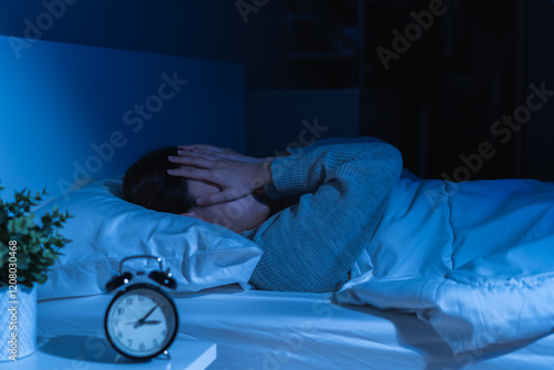 Annoyed, stressed, anxiety asian young woman suffering from insomnia, frustrated awake on bed at night, headache or migraine, health care problem, disturbed trouble of loud noise, unable sleepless.