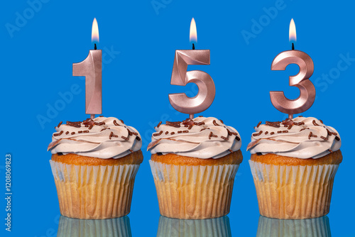 Birthday Cupcakes With Candles Lit Forming The Number 153.