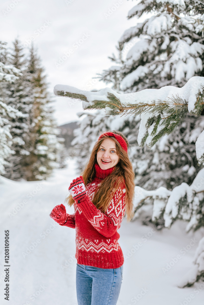 Excited Woman in Snow Covered Winter Forest