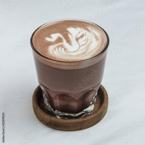 Hot chocolate with swan latte art on white background photo