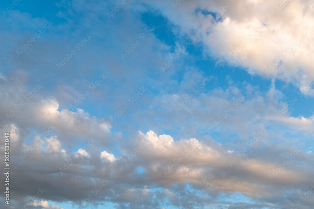 Blue Sky with Wispy Clouds at Sunset. This sky photo is perfect for backgrounds, themes of tranquility, nature, or freedom, and can be used in designs related to relaxation, inspiration or the outdoor Blue Sky with Wispy Clouds at Sunset. This sky photo is perfect for backgrounds, themes of tranquility, nature, or freedom, and can be used in designs related to relaxation, inspiration or the outdoor
