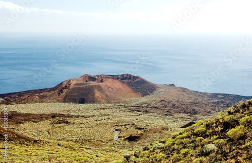 Obraz na płótnie El Hierro, Canary Islands, Spain. Geology. Volcano cone above the Faro de Orchilla on the west coast. w salonie