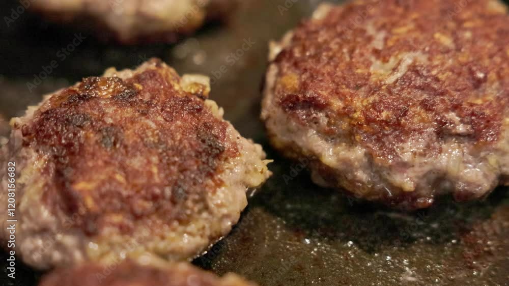 Savory cutlets sizzle in the skillet as the aroma fills the kitchen with delicious anticipation Savory cutlets sizzle in the skillet as the aroma fills the kitchen with delicious anticipation