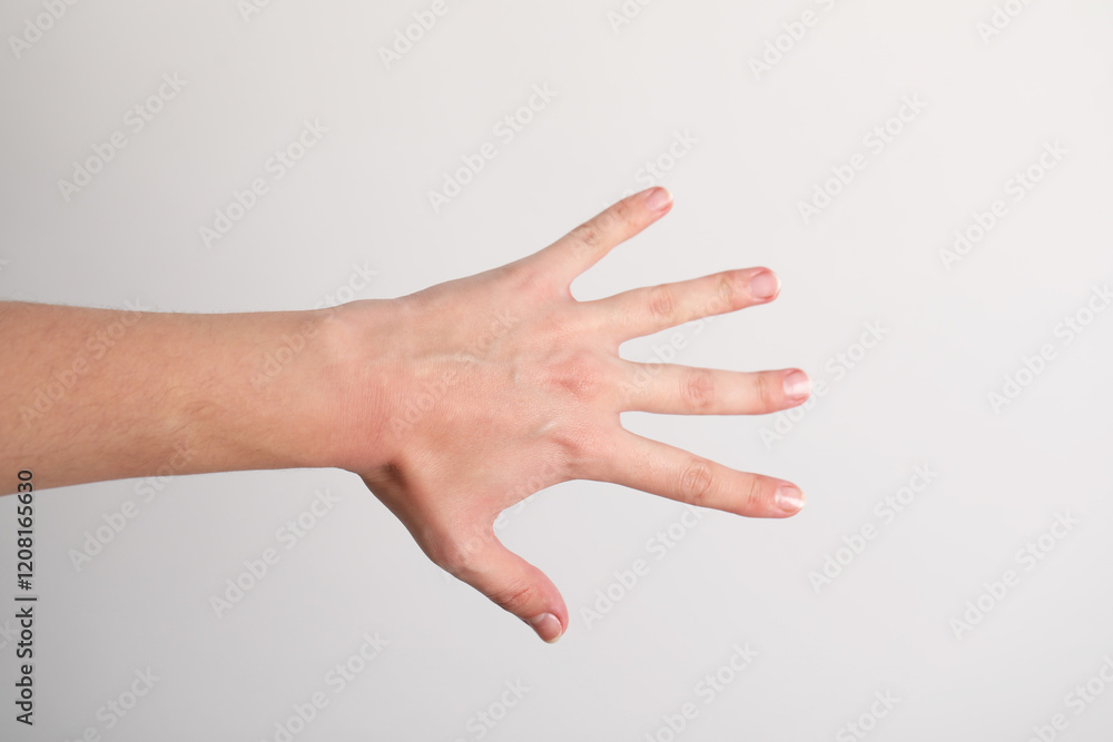 Woman with visible hand veins on light grey background, closeup Woman with visible hand veins on light grey background, closeup