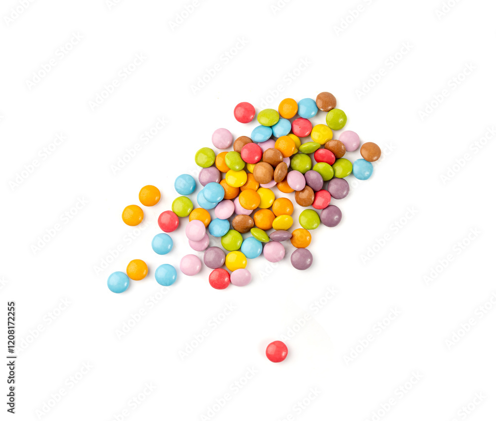 Obraz premium Scattered small candies isolated. Colorful dragees, multicolored glazed chocolate buttons