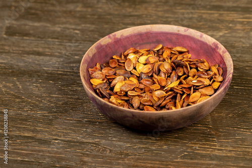 ripe pumpkin seeds fried to brown and golden photo