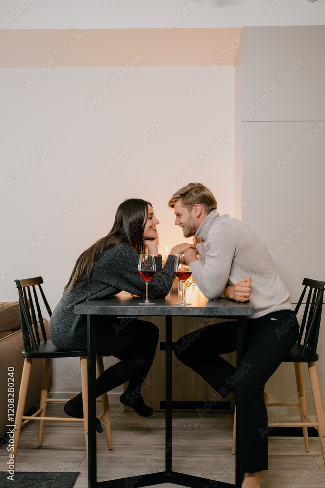 A young couple seated at a table with drinks, sharing an intimate conversation. The cozy and romantic atmosphere is enhanced by warm lighting and the delicate glow of the candlelight. A young couple seated at a table with drinks, sharing an intimate conversation. The cozy and romantic atmosphere is enhanced by warm lighting and the delicate glow of the candlelight.