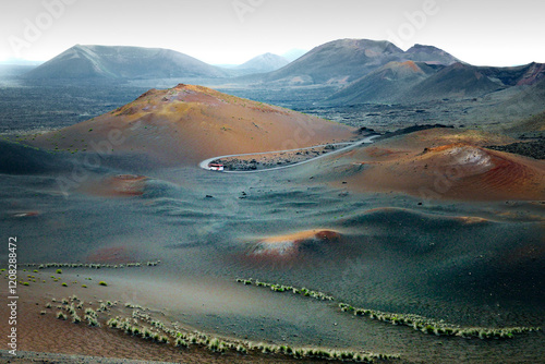 Obraz na płótnie Over tour bus in the Volcanic cones and lava fields of Timanfaya National Park, Lanzarote, Canary Islands. West toward El Golfo w salonie