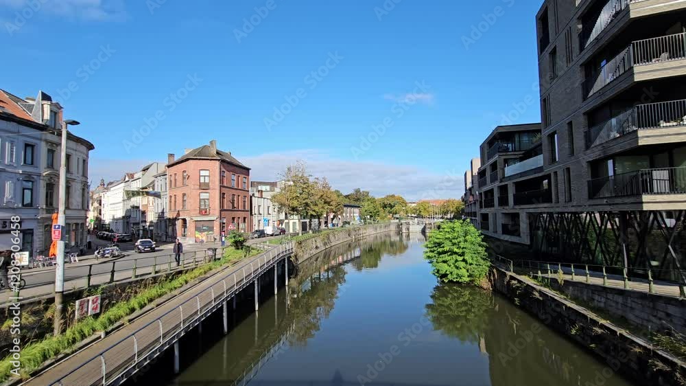 Gent, Belgium - October 11, 2024 - Summer Streets and Riverside Views of Ghent: Historic Buildings along the River Gent, Belgium - October 11, 2024 - Summer Streets and Riverside Views of Ghent: Historic Buildings along the River