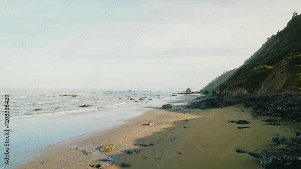 Peaceful California beach scene with waves gently crashing on sand. Peaceful California beach scene with waves gently crashing on sand.