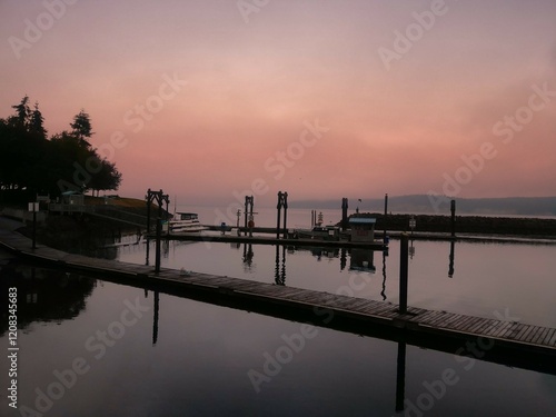 Scenic Sunrise Over a Tranquil Harbor in Sequim, Washington, Featuring Boats and Docks