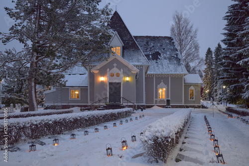 Old church in Finland in Tuusula during Christmas: decorations, lights, lanterns, twilight. photo