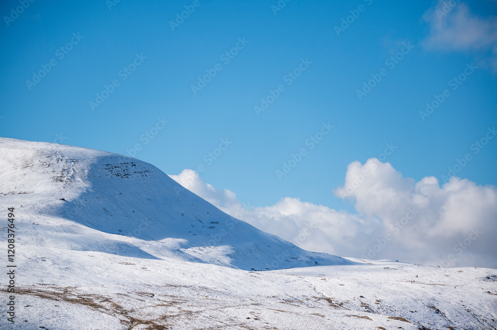 Layers of mountain ridges within the Brecon Beacons National Park. Looking west from Pen Y Fan towards the llyn Y Fan and Fan Fawr mountain range. The snow and rocks create a great contract image Layers of mountain ridges within the Brecon Beacons National Park. Looking west from Pen Y Fan towards the llyn Y Fan and Fan Fawr mountain range. The snow and rocks create a great contract image