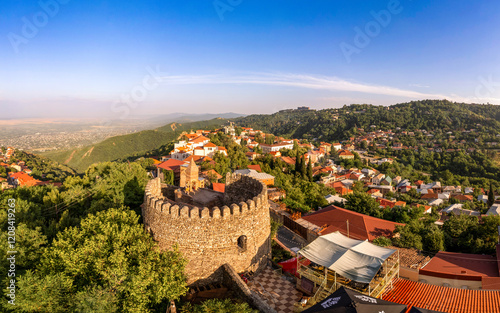 Aerial view on St. George's Church and Alazani valley, Georgia, Kakheti region, Signagi village. Sighnaghi city of love on hill near Gombori Range. Drone Photography in sunny summer day.