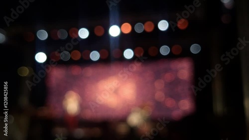 Stage lights at the music festival, colorful defocused background