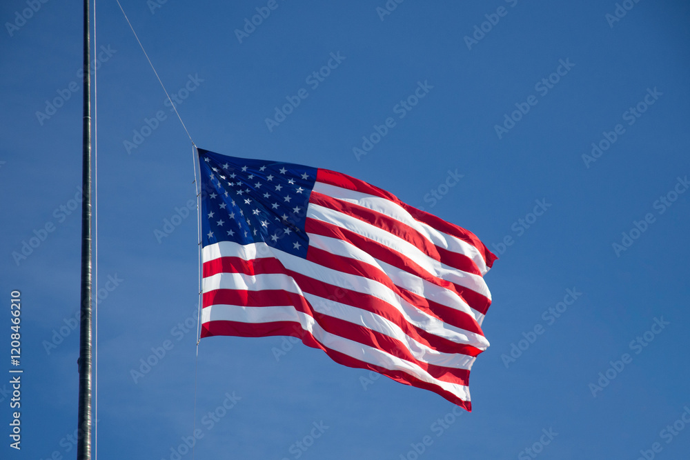 Fototapeta premium American Flag Waving in the Wind.
