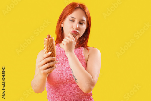 Thoughtful young woman with...