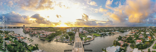 Boca Raton Florida Sunset. An aerial panoramic view over a drawbridge. Bright yellow and light blue colors in the sky. 
