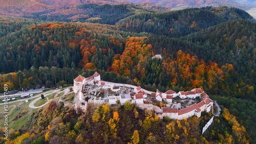 Experience the beauty of Râșnov Fortress through a drone’s lens, capturing its timeless charm, towering walls, and breathtaking surrounding vistas.