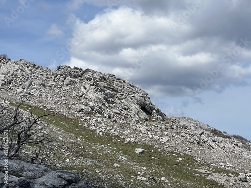 Limestone rocks and karst mountain landscape - Northern Velebit National Park, Croatia (Vapnenačke stijene i krški planinski krajolik - Nacionalni park Sjeverni Velebit, Hrvatska) photo