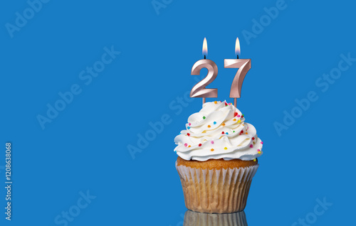 Birthday Or Anniversary Cupcake With Lit Candles; Candles Forming The Number 27.