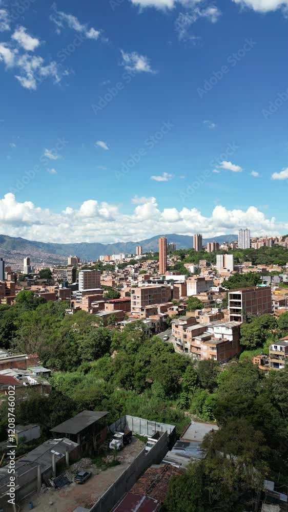 A breathtaking aerial drone view of Medellín, Colombia, showcasing its vibrant cityscape, lush greenery, and stunning mountainous backdrop. This dynamic footage highlights the urban and natural beauty A breathtaking aerial drone view of Medellín, Colombia, showcasing its vibrant cityscape, lush greenery, and stunning mountainous backdrop. This dynamic footage highlights the urban and natural beauty