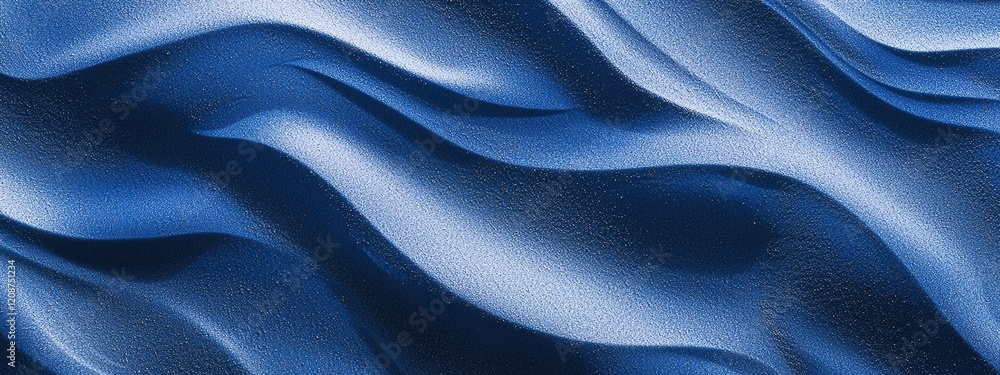 Fototapeta premium Dusty blue sand dunes with intricate windblown patterns in natural setting