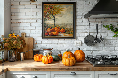 cozy kitchen scene featuring pumpkins on wooden countertop, with beautiful autumn themed painting on wall. warm colors create welcoming atmosphere photo