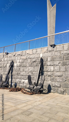 Penza, Russia - July 13, 2024: Decorative object To the Defenders of the Sea Borders of the Fatherland. Developed public space. Embankment of the Sura River. Summer morning photo