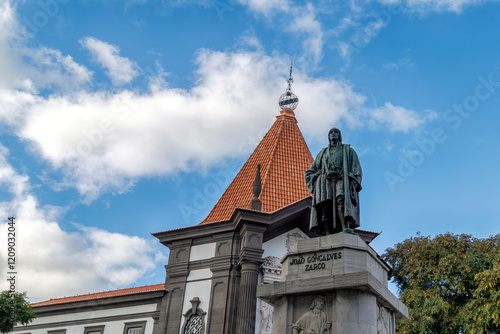 view on the statue of João Gonçalves Zarco, the discoverer of Madeira, with the historic “Banco de Portugal” building in the background photo