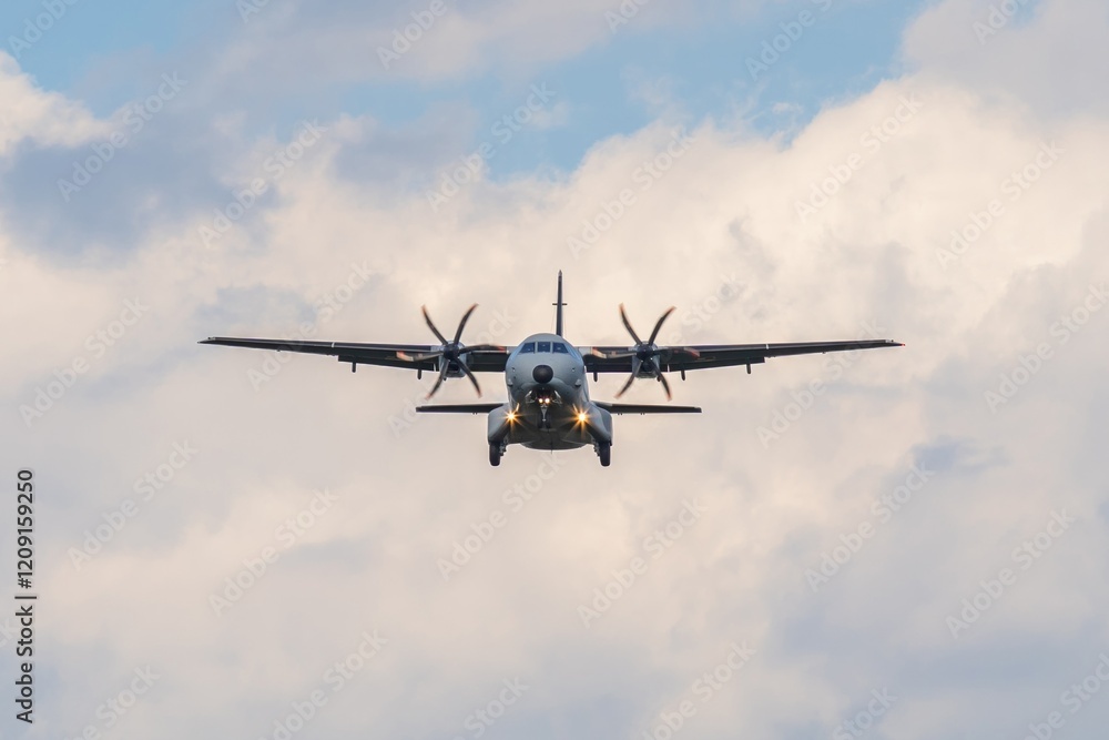 Military aircraft approaches for landing under a cloudy sky during daylight hours in a serene environment Military aircraft approaches for landing under a cloudy sky during daylight hours in a serene environment