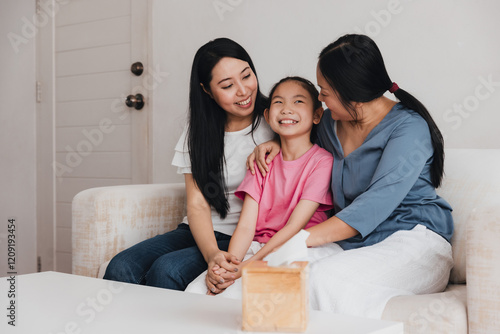 Family celebrates love and joy in home adoption moment between two mothers and their daughter