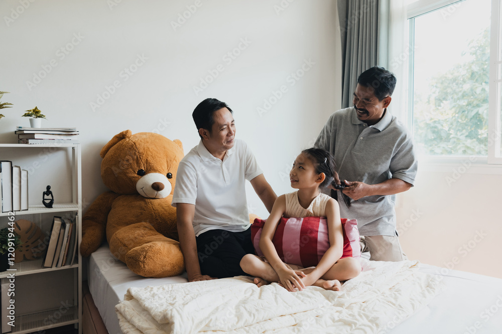Loving LGBTQ couple spending quality time with their adopted daughter in a cozy bedroom Loving LGBTQ couple spending quality time with their adopted daughter in a cozy bedroom