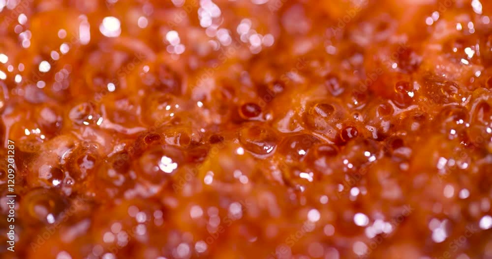 natural red caviar close up, a delicacy of red salmon caviar during cooking natural red caviar close up, a delicacy of red salmon caviar during cooking