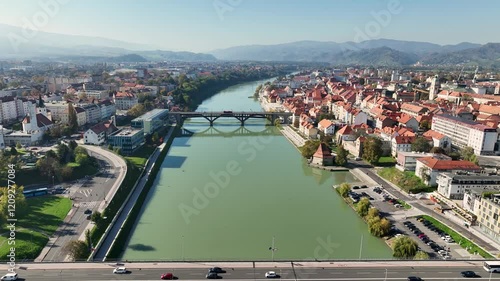 Amazing panoramic video of Maribor old town with bridges and beautiful red roofed houses along Drava river in Slovenia