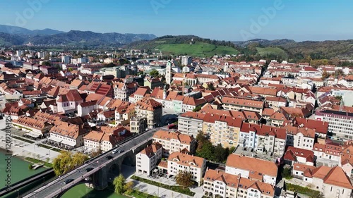 Amazing panoramic video of Maribor old town with bridges and beautiful red roofed houses along Drava river in Slovenia