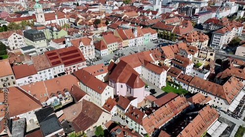 Amazing panoramic video of Maribor old town with bridges and beautiful red roofed houses along Drava river in Slovenia
