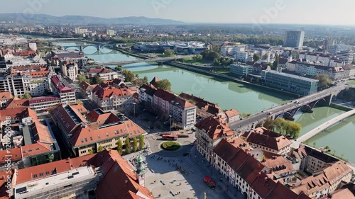Amazing panoramic video of Maribor old town with bridges and beautiful red roofed houses along Drava river in Slovenia