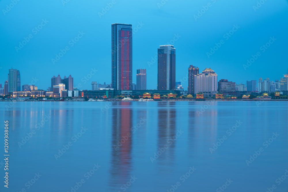 Fototapeta premium The urban skyline and Ganjiang River scenery of Nanchang City, Jiangxi Province, China on April 1, 2024