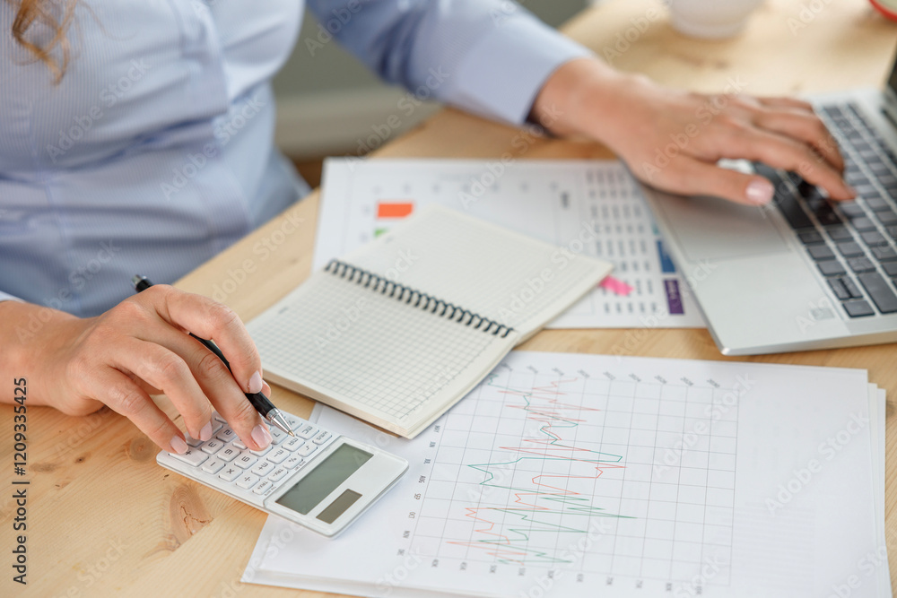 Businesswoman financial planning and making accounting database report at workplace Businesswoman financial planning and making accounting database report at workplace