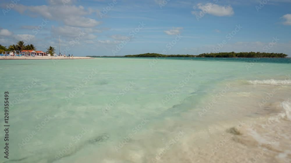 A Serene Tropical Beach Featuring Clear Turquoise Waters Accompanied by Soft White Sands A Serene Tropical Beach Featuring Clear Turquoise Waters Accompanied by Soft White Sands