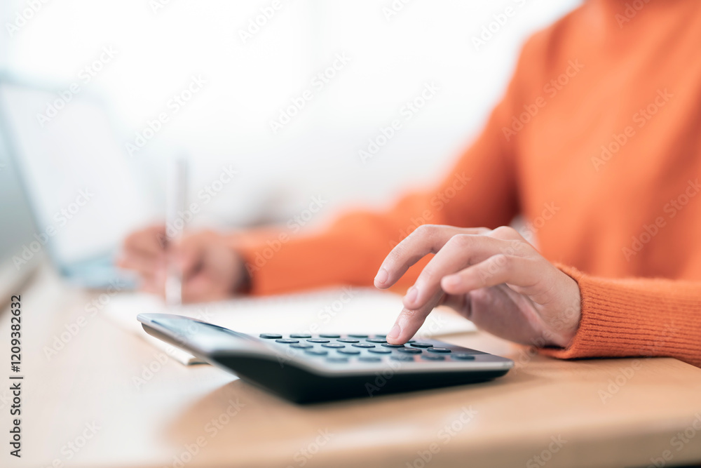 Close up woman hand using calculator. Doing finance, budgeting and tax calculation, monthly expenses. Close up woman hand using calculator. Doing finance, budgeting and tax calculation, monthly expenses.