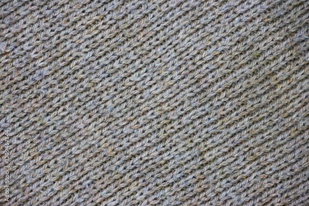 Macro texture of woolen pastel crocheted sweater as background, close-up of brown crocheted front surface, woolen texture of woolen wool, trend pastel crocheted front surface Macro texture of woolen pastel crocheted sweater as background, close-up of brown crocheted front surface, woolen texture of woolen wool, trend pastel crocheted front surface